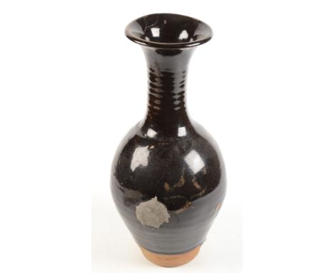 A Bernard Leach tenmoku large stoneware vase, with impressed and personal seals, damage and repair, height 47cm.From the Bret