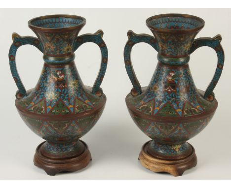 A pair of Chinese cloisonne twin handled vases, 19th century, seal mark to base, height 31cm,