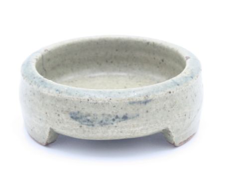 A rare miniature early Leach small dish, of cylindrical form decorated with three blue brushwork fish, diameter 9cm x height 