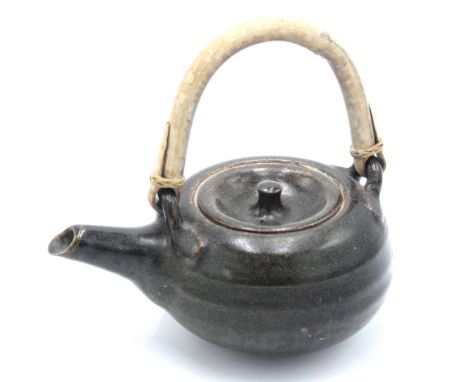 A Brett Guthrie Leach Pottery stoneware teapot, with bamboo handle, personal and pottery seal.From the Bret Guthrie Collectio