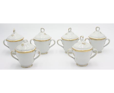 A set of six Worcester twin handled cups, the covers with gilt loop finial, one cover damaged.