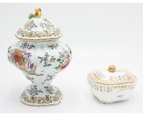 A Spode square section sugar bowl and cover, pattern No. 3913 together with a Majolica polychrome armorial jar and cover with