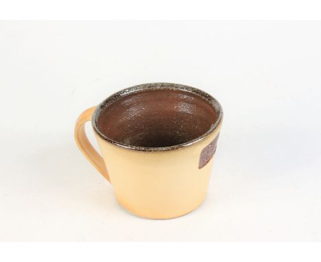 A Leach pottery mug, inscribed 1920, 2010, height 7.5cm, diameter 10.5cm.