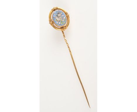 A high purity gold micromosaic stick pin showing a bird perched on a flowering branch. 