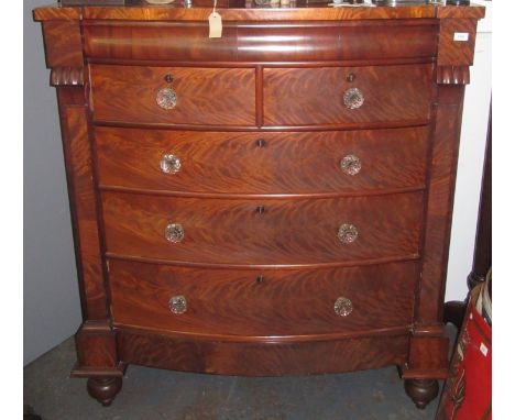 A Victorian mahogany veneered bow front Scotch chest with glass knobs, width 125cm, height 140cm.