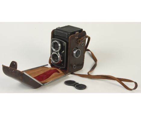 A Prinz camera with a Yashica Copal-MXV lens, in a brown leather case.