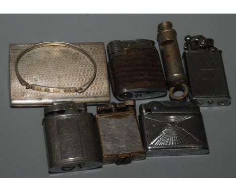 A silver cigarette case, a silver bangle, five cigarette lighters and a War Department whistle dated 1944.
