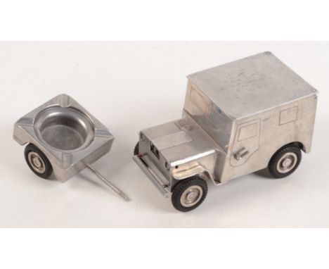 A German table cigarette lighter in the form of a WW2 jeep and trailer, inscribed Ges. Gesch to the underside  Condition repo