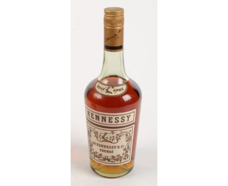A bottle of JAs. Hennessy &amp; Co Bras Arme Cognac, height 28cm.