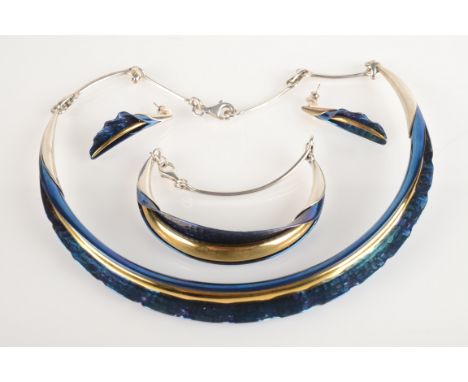 A contemporary silver gilt and blue enamel suite.