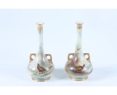 A pair of Royal Worcester porcelain vases, signed Jas Stinton, pheasant decorated with gilt handles, shape no 943, height 16.