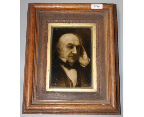 A Sherwin &amp; Cotton portrait tile of William Gladstone from a portrait by S Mendelssohn in an oak frame, tile measures 21.