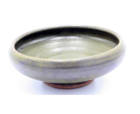 A Brett Guthrie Leach stoneware shallow bowl, with greenish tenmoku glaze, impressed seals, diameter 6.5cm, height 6cm.From t