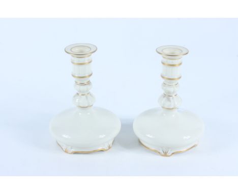 A pair of Royal Worcester Grainger &amp; Co candle holders, shape no 280, height 15.5cm. 