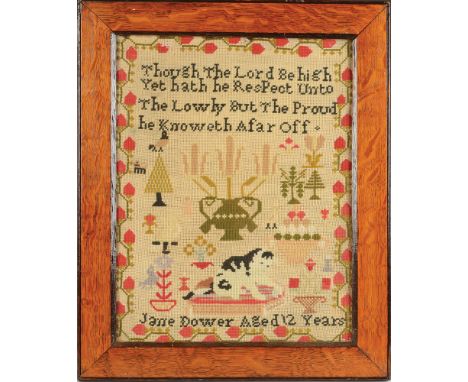 A needlework sampler by Jane Dower, aged 12 years, with verse and a cat seated on a cushion, 48 x 39.5cm.