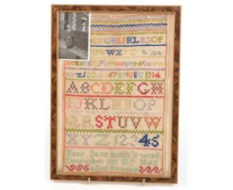 A needlework sampler by Mary Jane Smith, December 12th 1862, aged 8 years, framed and glazed, 28.5 x 18.5cm.