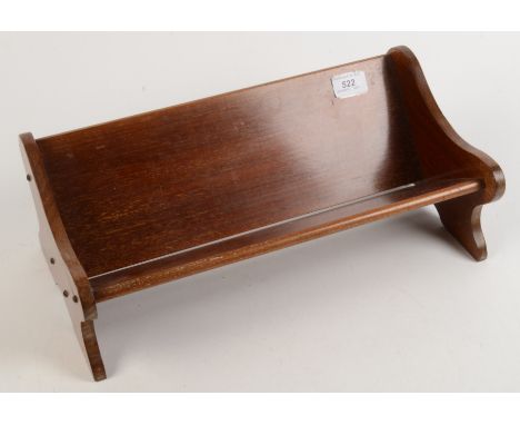 A Globe Wernicke mahogany book trough, metal maker's label to reverse, height 15.5cm, width 40.5cm. 