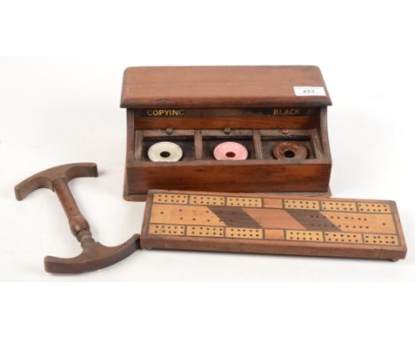 A mahogany inkstand circa 1900, height 11cm, width 27cm a cribbage board, length 30.5cm and a hat stretcher, length 18.5cm.
