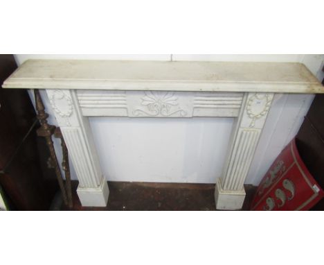 A marble fire surround, the rectangular moulded shelf above a floral and scroll decorated frieze, flanked by wreaths and flut