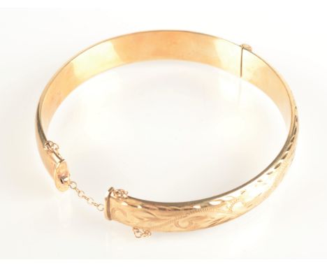 A 9ct gold bangle, 12.1g.
