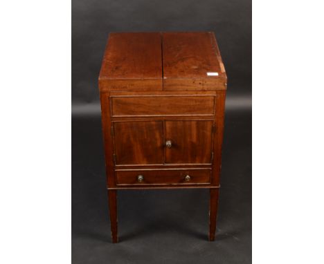 A mahogany commode, early 19th century, with a pair of cupboard doors above a single drawer on square tapering legs, height 8