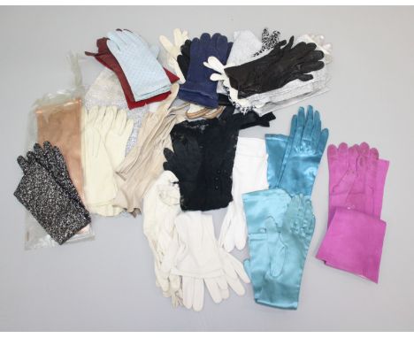 A collection of gloves comprising of 15 pairs of evening gloves, 10 pairs of leather gloves, 3 pairs of fabric gloves and a s