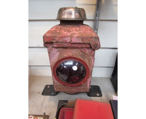 A red painted crossing gate lamp, copper cap embossed B.R. (E)