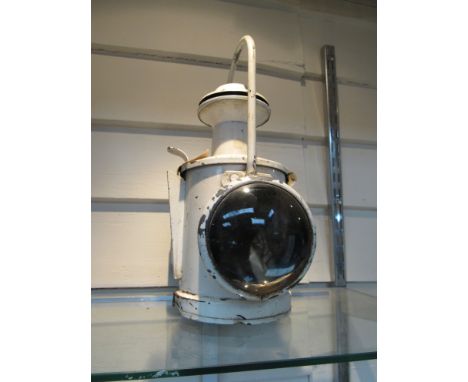 An LNER locomotive headlamp with reservoir, ceramic burner and revolving red aspect