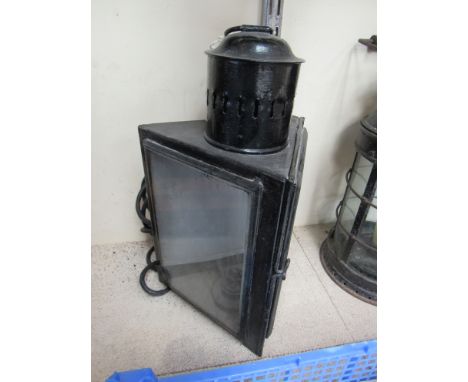A three sided railway station wall lamp with bracket, converted to electric