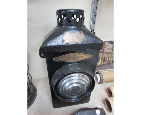 An LMS Adlake No.22 level crossing lamp case with clear bulls eye lens front