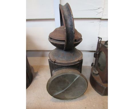 An LNER railwaymans three aspect hand lamp stamped ESSENDINE, two aspects missing, brass plate on one side