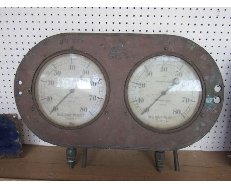An E. Bourbons twin pressure gauge showing Inlet/Outlet, possible from a stationary engine