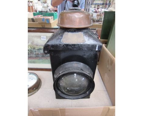 An Adlake LMS signal post lamp case with reservoir interior, burner and chimney, bullseye front aspect with smaller rear