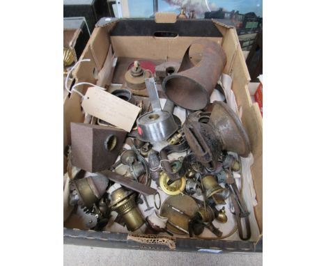 A box containing various oil lamp parts to include burners, reservoirs and aspects