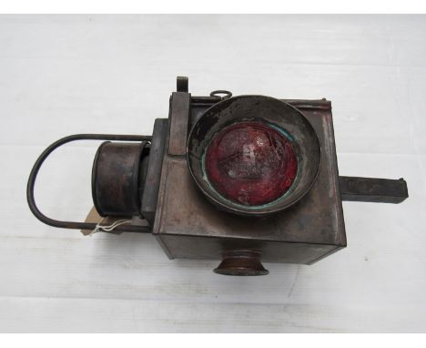 An Isle of Man level crossing lamp reputedly from PEEL station with interior reservoir and ceramic burner, clear and red aspe