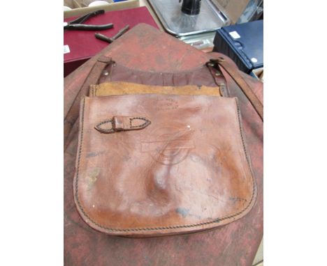 A London Transport brown leather cash satchel and A GER guards ticket punch and T-key carriage key  (2)