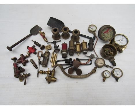 A bag containing various scale live steam fittings including pressure gauges, safety valves, whistles, etc