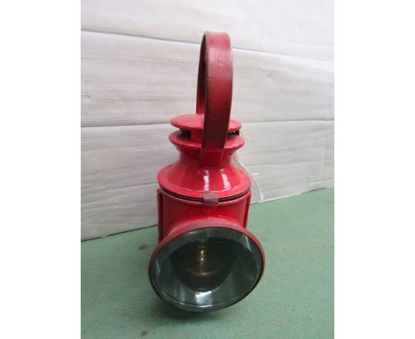 A L.P.T.B. (London Passenger Transport Board) red painted handlamp, handle stamped ERN 195, copper reservoir and ceramic burn