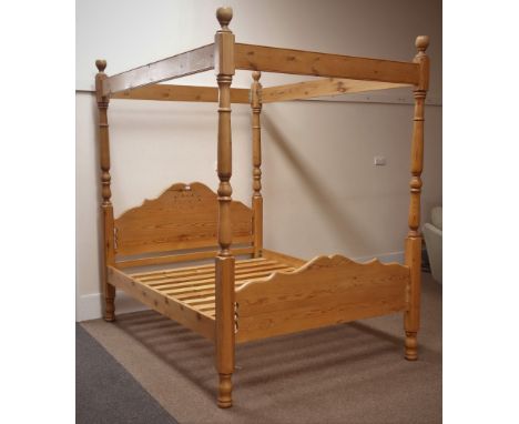 Solid waxed pine 5' kingsize four poster bed, shaped and moulded head and footboard, headboard with pierced decoration, turne