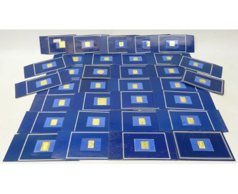 Collection of thirty-three Franklin Mint silver gilt stamp replicas, each sealed in a card display (33) Condition Report Clic