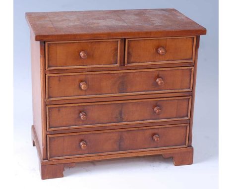 An apprentice piece type walnut chest in the 18th century style, having two short over three long drawers, on bracket feet, c