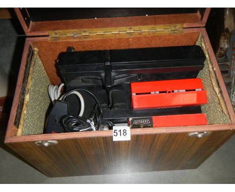 A mid 20th century Praktica 150 projector complete with slides.&nbsp;COLLECT ONLY