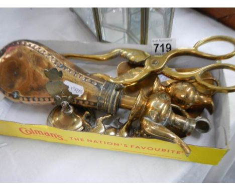 A Victorian Sykes powder flask, brass coal tongs and other brassware.