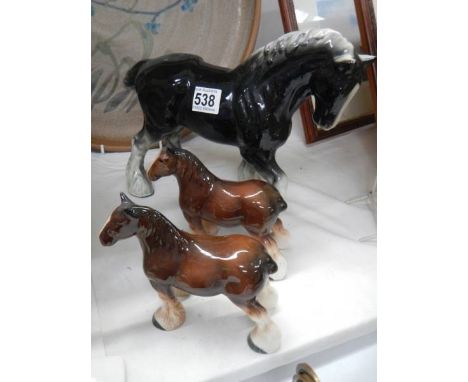 Three ceramic horses.