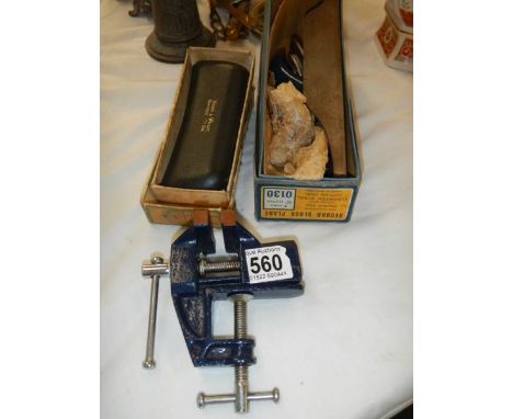 A small vice and other tools.