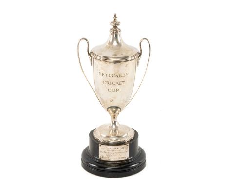 THE CRICKET CLUB HOUSE: SILVER CRICKET TROPHY, entitled ‘Brylcreem Cricket Cup’, plinth with plaque engraved ‘D. Shackleton, 