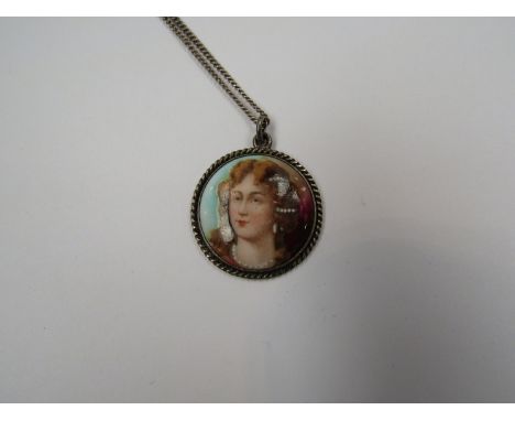 A necklace with portrait pendant
