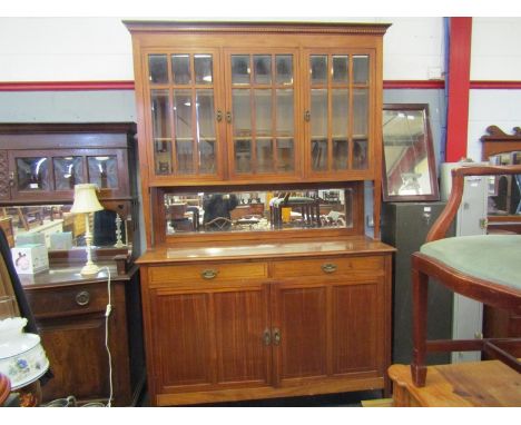 A late 19th Century French mahogany three door panel glazed sideboard, with two drawer two door base, 235cm high x 150cm wide