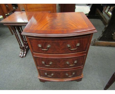 A pair of reproduction mahogany chests of three drawers, swan neck handles and bracket feet, 65cm high x 48cm wide each