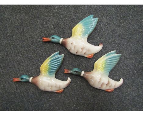 Three vintage ceramic wall mounted flying ducks
